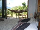 floor-to-ceiling glass doors -watch the wildlife from in bed!